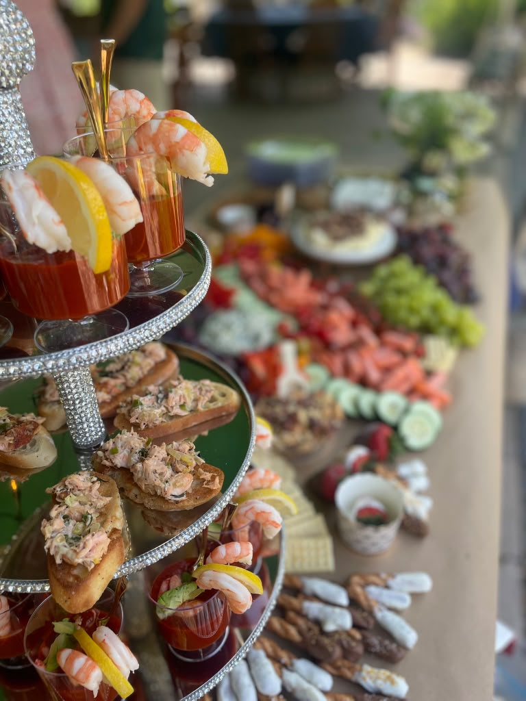 Shrimp cocktail and tuna crostini tower styled for an outdoor spread